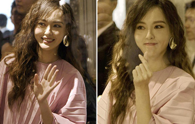 唐嫣隔玻璃对粉丝比心,灿笑摆拍在路人视角下也美到窒息!